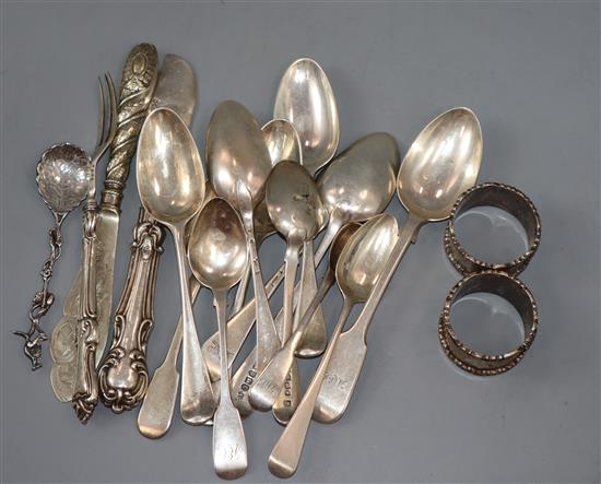 Twelve items of 18th and 19th century flatware and six other items including a pair of silver napkin rings.